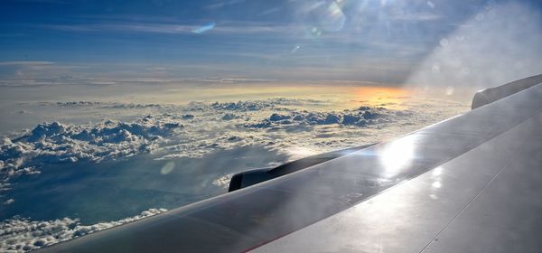 Aerial view of airplane flying in sky