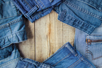 Midsection of woman wearing torn jeans