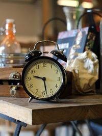 Close-up of clock on table