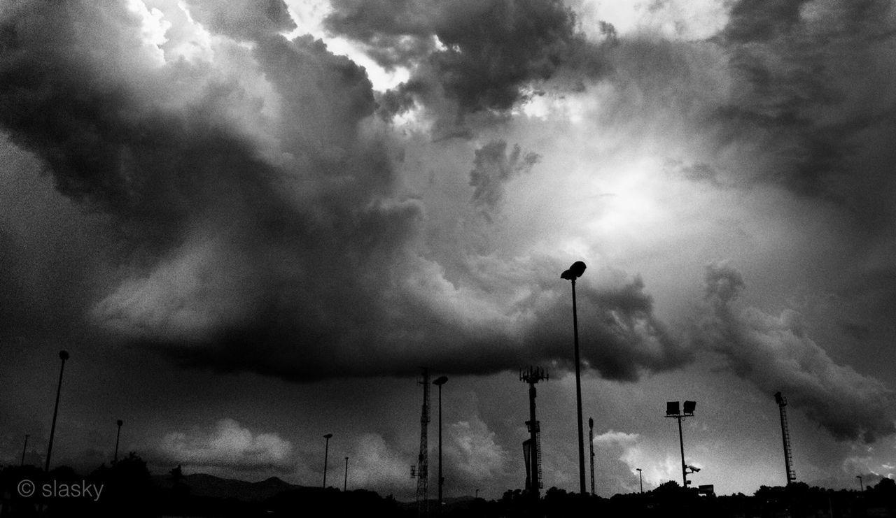 sky, cloud - sky, cloudy, low angle view, street light, weather, silhouette, overcast, lighting equipment, storm cloud, cloud, dusk, electricity, electricity pylon, nature, dramatic sky, beauty in nature, cloudscape, outdoors, power line