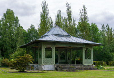 Built structure on field against sky