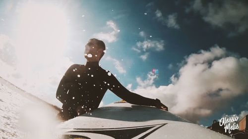 Low angle view of man against sky