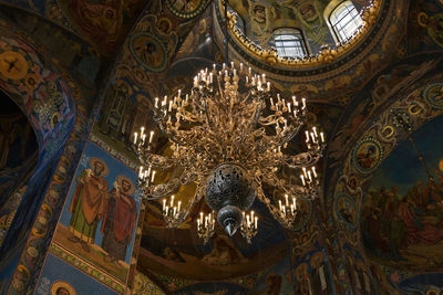 Low angle view of illuminated sculpture in building