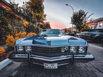 Cars parked on street in city during autumn