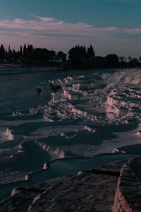 Scenic view of pamukkale against sky during sunset