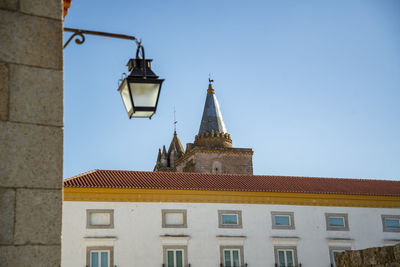 Low angle view of building against clear blue sky