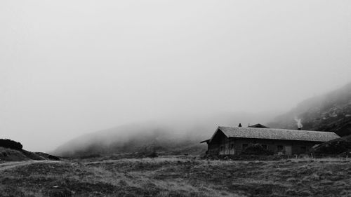 Scenic view of mountains in foggy weather