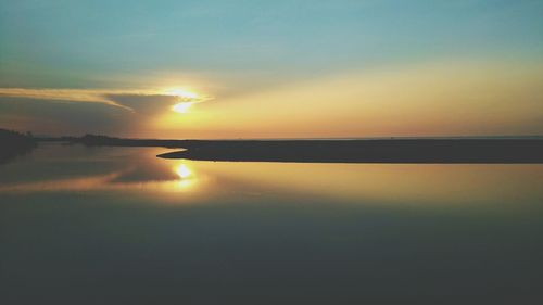 Scenic view of sea at sunset