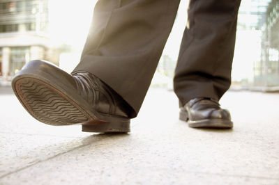 Low section of man standing on floor