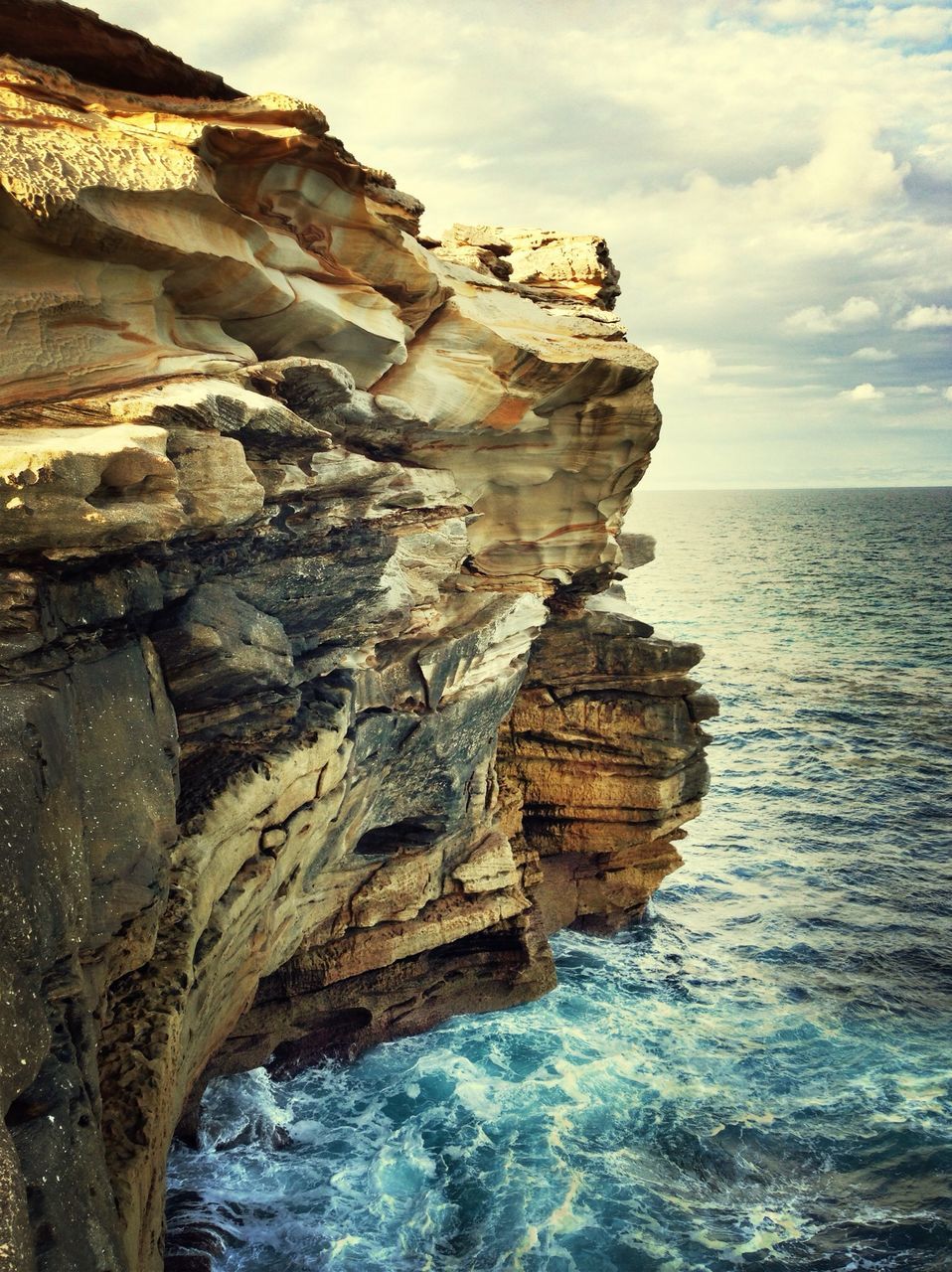 water, sea, rock formation, rock - object, sky, scenics, horizon over water, tranquil scene, beauty in nature, tranquility, nature, cliff, rock, waterfront, idyllic, geology, cloud - sky, cloud, rocky, outdoors