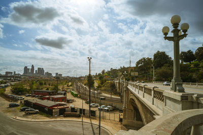 High angle view of street and buildings against sky