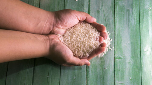 Close-up of hand holding rice