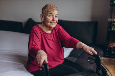 Portrait of boy sitting at home