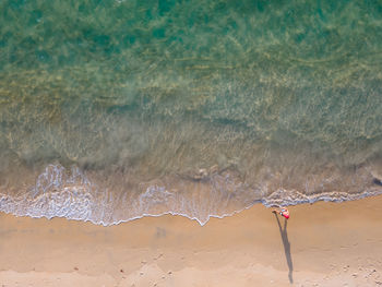 Umbrella on beach against sea