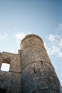 Low angle view of fort against sky