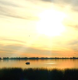 Scenic view of sunset over calm sea