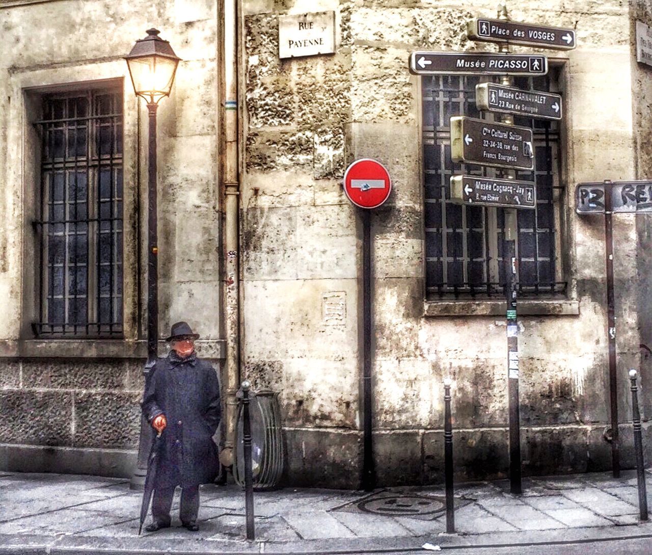 building exterior, architecture, built structure, text, communication, street, full length, western script, door, city, rear view, road sign, men, lifestyles, walking, safety, wall - building feature, standing