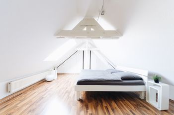 Interior of illuminated bedroom at home