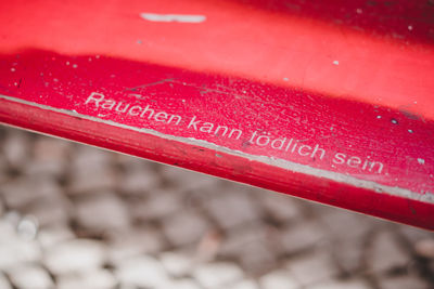 Close-up of red text on water