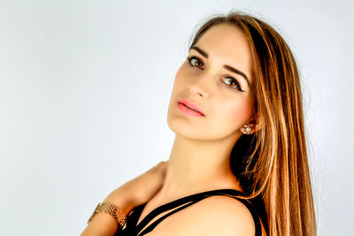 Portrait of a beautiful young woman over white background