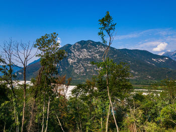 Scenic view of mountains against clear blue sky