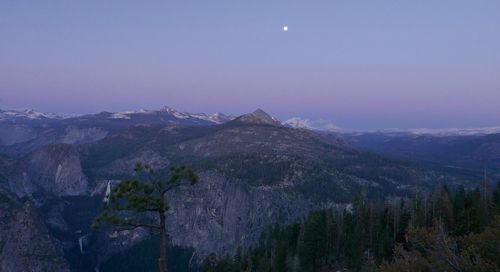 Scenic view of mountains against sky at night