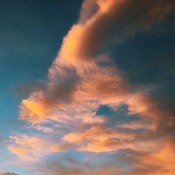 Low angle view of cloudy sky at sunset