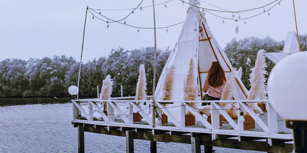 Clothes hanging on table against clear sky