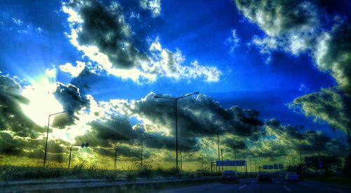 View of road against cloudy sky