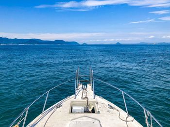 Yacht sailing in sea against sky