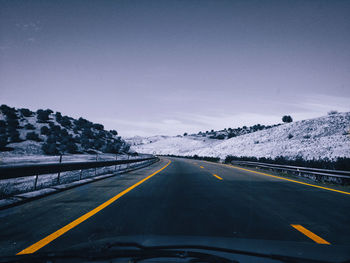 Road against sky during winter