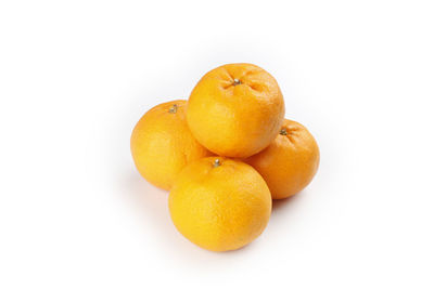 Close-up of oranges against white background