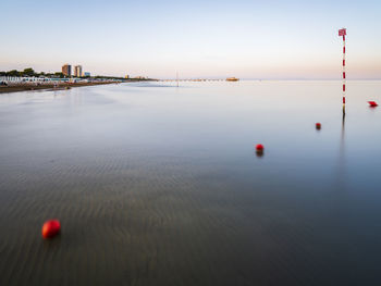 Sunset and twilight on the beach of lignano pineta. italy