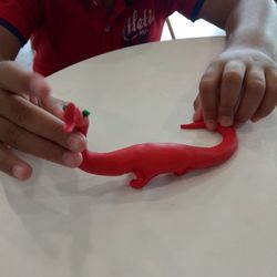 High angle view of baby hand on table