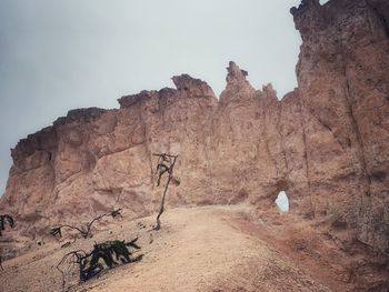 Rock formation on land against sky