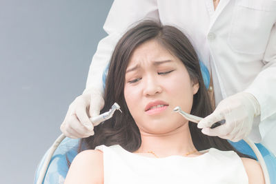 Portrait of young woman at dentist's