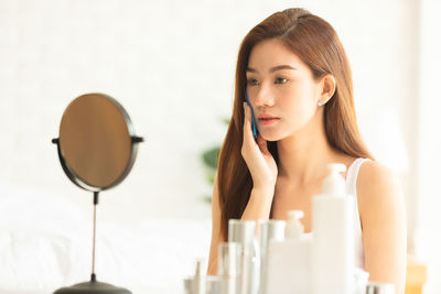 Portrait of young woman looking away