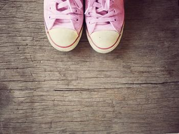 High angle view of shoes on wooden table