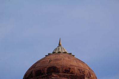 Low angle view of historic building against clear blue sky