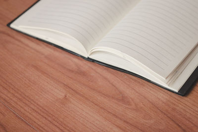 High angle view of open book on table