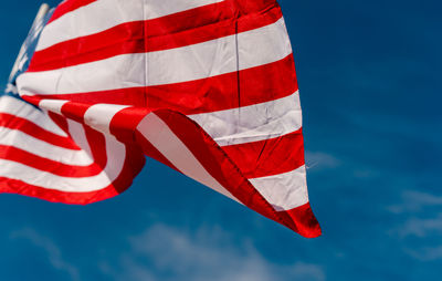 Close-up of flag against blue sky