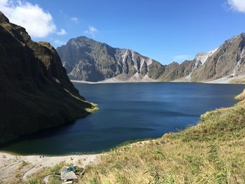 Scenic view of lake and mountains against sky