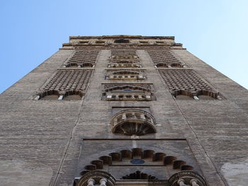 Low angle view of bell tower against sky