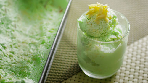 High angle view of ice cream in drinking glass on table