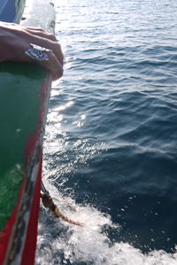 Low section of person on boat in sea