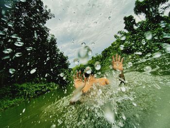 High angle view of man swimming in lake