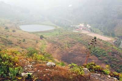 High angle view of landscape in foggy weather