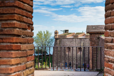 View of old building against cloudy sky