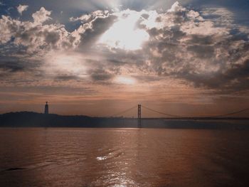 Scenic view of river against sky during sunset