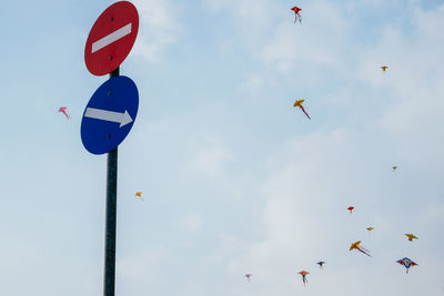 Low angle view of birds flying in sky